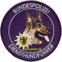 Bild von Bundespolizei Diensthundführer Schäferhund blau mit Klett