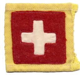 Bild von Schweizerkreuz aus Filz auf gelbem Stoff